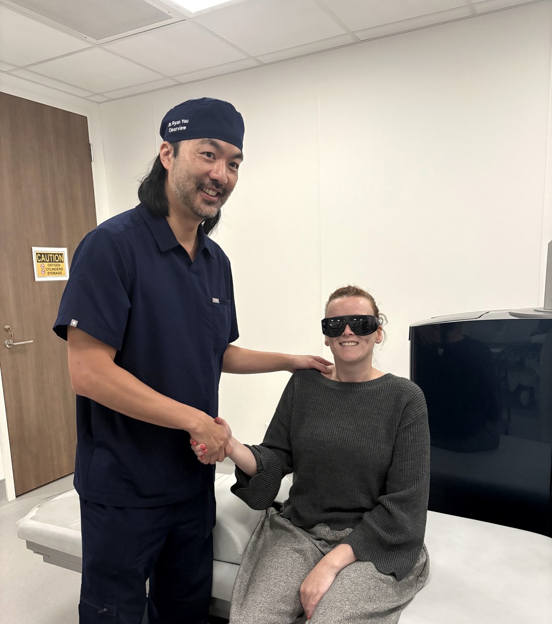 Dr. Ryan Yau with a PRK patient wearing protective sunglasses after treatment